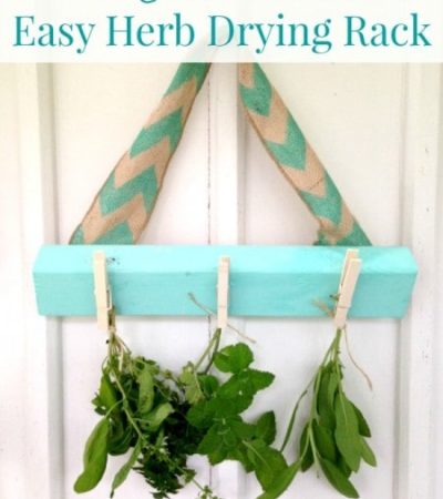Easy DIY Herb Drying Rack - Create this herb drying rack so you can dry herbs in your kitchen. You just need scrap wood, paint, clothespins, and ribbon.