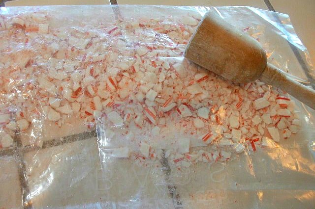 Crush Candy-Canes before adding them to the top of the white chocolate to make this easy 3 Ingredient peppermint bark recipe