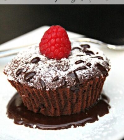 Chocolate Raspberry Lava Cake- Here is an easy and decadent dessert everyone will love. This Lava Cake is dripping with chocolate and topped with raspberry.