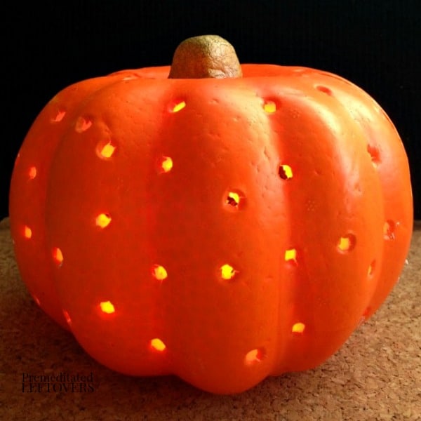 how to make a diy pumpkin lantern using a dollar store foam pumpkin and twinkle lights