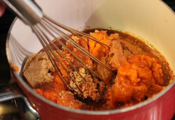 Spiced Pumpkin Butter mixing ingredients in pot.