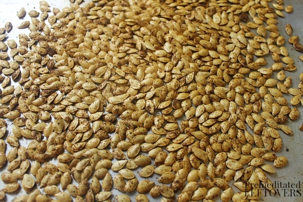 Roasted Acorn Squash Seeds on a baking sheet
