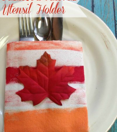 Painted Canvas Utensil Holder- Dress up your Thanksgiving table with this homemade utensil holder. No sewing is required with this simple and frugal craft.