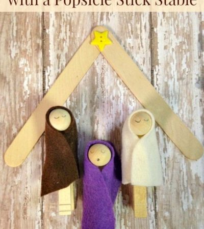 Clothespin nativity scene with a Popsicle stick stable