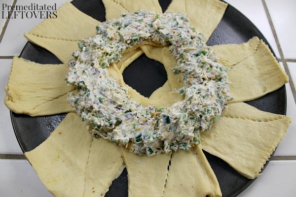 Jalapeno popper dip spread on crescent roll dough ring