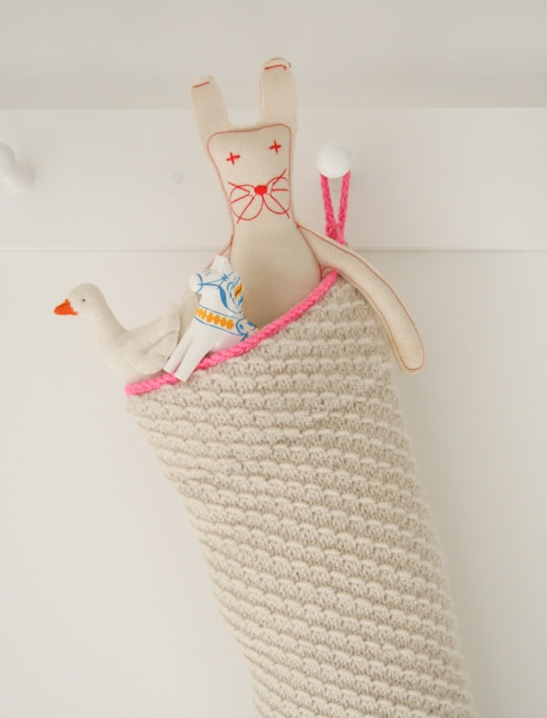 Beautiful white heirloom Christmas stocking made with free Christmas stocking knitting pattern