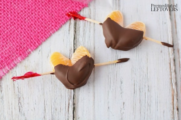 Chocolate Dipped Clementine Hearts ready to be placed in a snack bag to create a healthy Valentine's Day treat