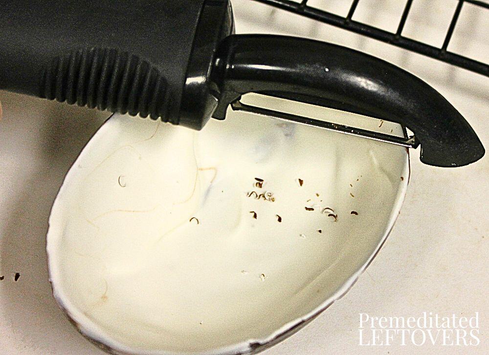 Trimming the top edge of the chocolate eggs