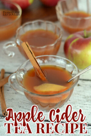 hot apple cider tea in a cup with a cinnamon stick