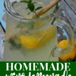 homemade mint lemonade in a pitcher with lemon slices and fresh mint