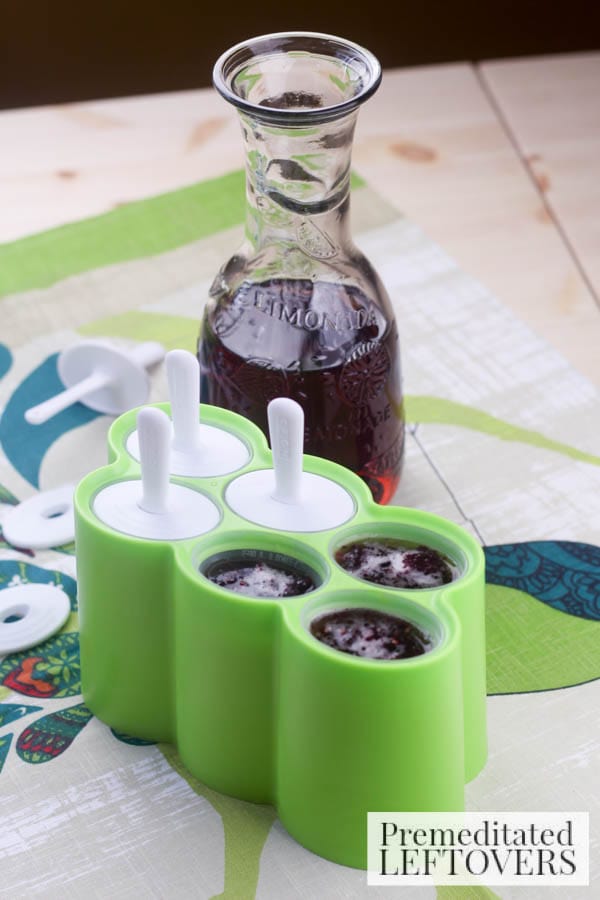 Blackberry Sweet Tea Popsicles- pouring in molds