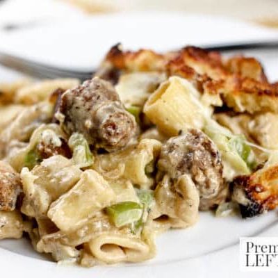 Creamy Cheese and Brat Casserole- This budget-friendly recipe combines creamy Alfredo sauce with pasta and bratwurst to make a hearty meal in under an hour.