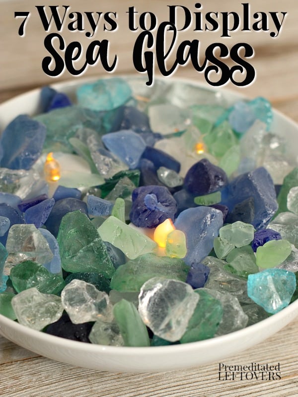 Colored sea glass in a bowl with battery-operated votive candles.