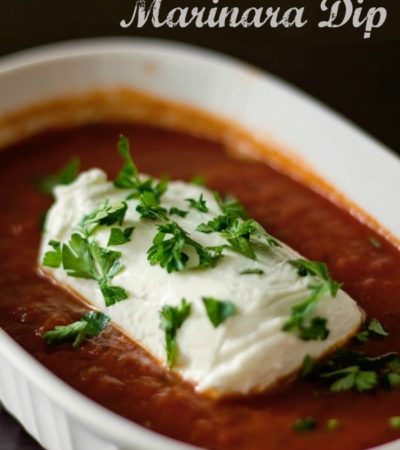 Goat Cheese and Marinara Dip- This quick and easy appetizer recipe is made with soft goat cheese and marinara sauce. Enjoy it with crackers or french bread.