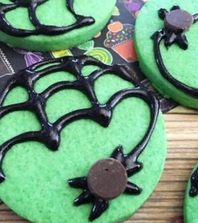 These Mint Spider Cookies are a perfect treat to make this Halloween. The recipe includes a mint sugar cookie base and step-by-step decorating instructions.