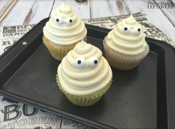 Vanilla Ghost Cupcakes- cupcakes on a tray