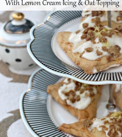 These Blueberry Hand Pies with Lemon Cream Icing and Oat Crunch are a delicious dessert made with fresh fruit. Serve them with brunch or tea with friends.