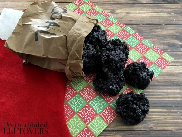 This Lump of Coal Rice Krispie Treats Recipe is fun to make and receive around Christmas! Oreos and food coloring help these treats look just like coal!