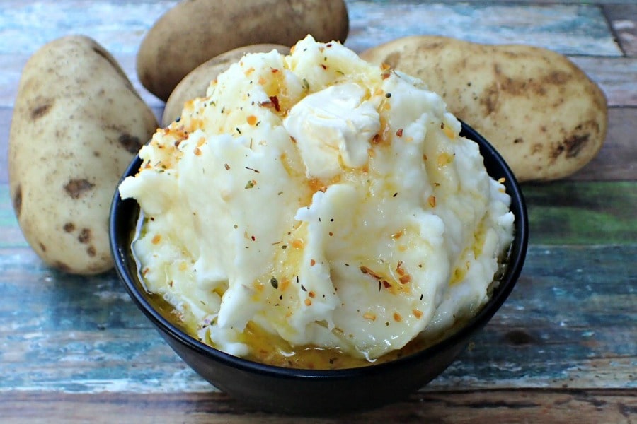 These Garlic Butter Mashed Potatoes are a flavorful yet easy mashed potato recipe! Serve them on Thanksgiving or whip them up for your next family dinner.