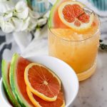 Enjoy a glass of sunshine regardless of the weather with this Watermelon and Orange Cocktail. This easy recipe includes a mix of spirits and fresh fruit.