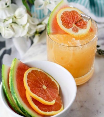 Enjoy a glass of sunshine regardless of the weather with this Watermelon and Orange Cocktail. This easy recipe includes a mix of spirits and fresh fruit.