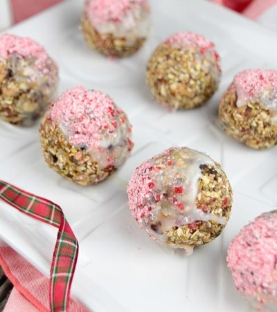 These festive White Chocolate Dipped Oatmeal & Fruit Balls are sprinkled with crushed candy cane. Make this easy recipe and spread the holiday cheer!
