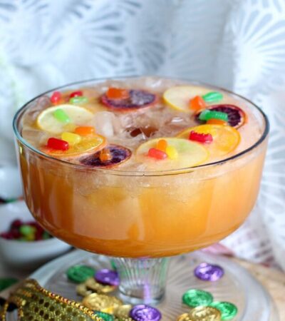 It's Mardi Gras time. Here's one delicious way to get festive during Mardi Gras season. Try our Mardi Grad Festive Punch, mixed with a King Cake Soda Ice Ring, rum and more. I'm also sharing a virgin festive punch recipe! Cheers!