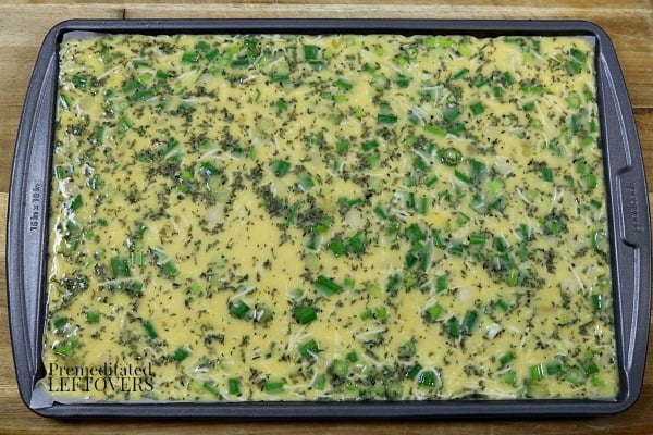 Pour the egg mixture into the baking sheet