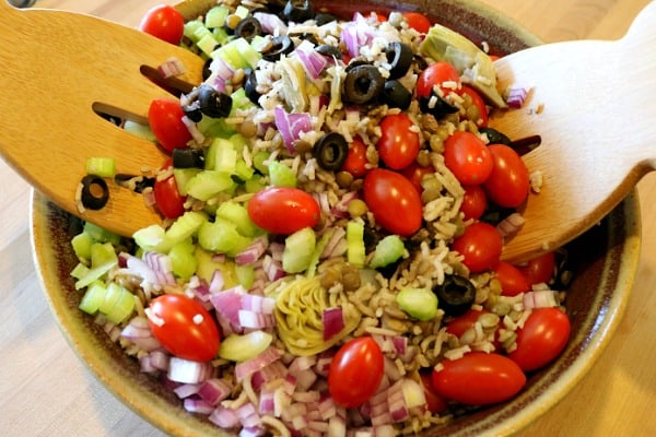 Toss vegetables with the lentils and rice until the Greek Salad is thoroughly combined
