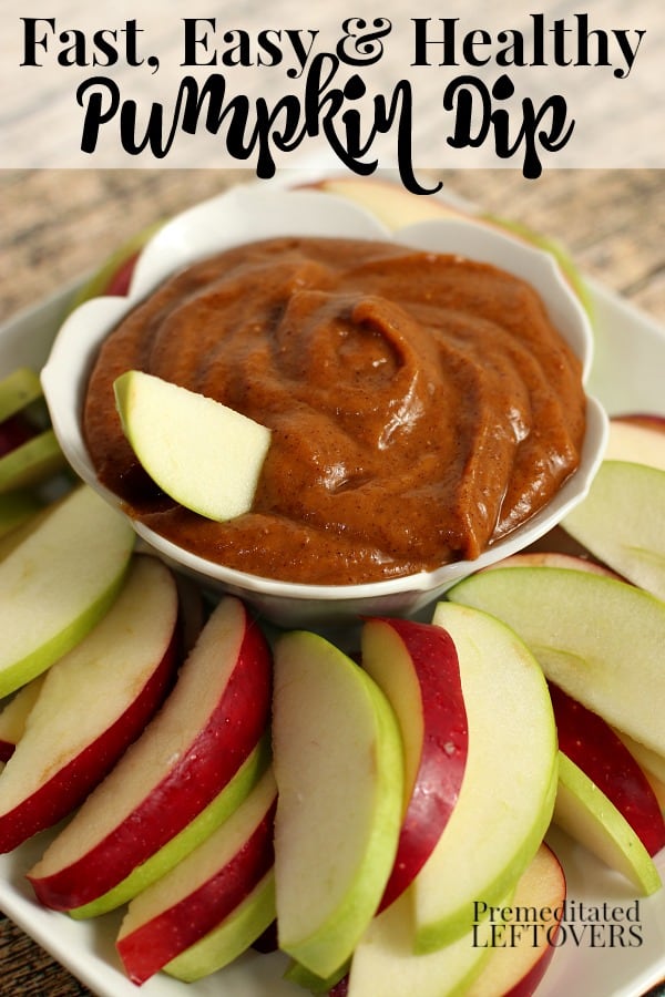 A batch of healthy pumpkin dip recipe in bowl with sliced red and green apples.