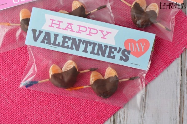Chocolate Dipped Clementine Hearts in a snack-size baggy with a Valentine's Day topper stapled to the top.