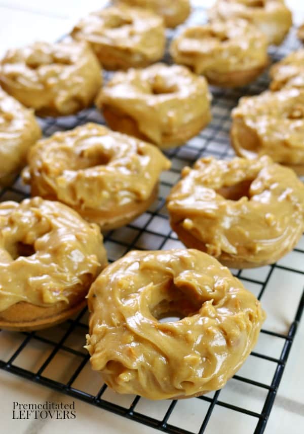 peanut butter doughts that have just been topped with peanut butter glaze