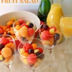 Mimosa Fruit Salad recipe served in wine glasses.