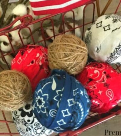 Basket of DIY twine balls and patriotic rag ball using red, white, and blue bandannas.