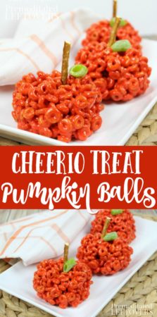 Cheerio treat pumpkin balls with pretzel sticks for stems.