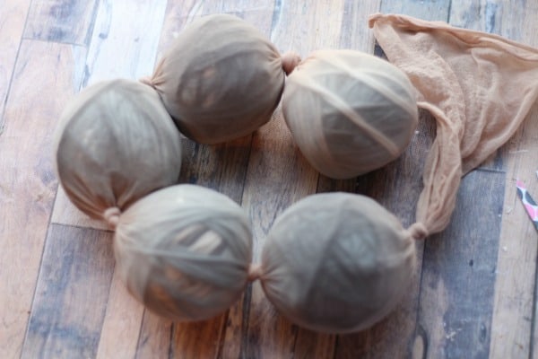 homemade wool dryer balls knotted into ladies nylons.