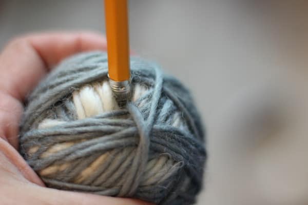 DIY wool dryer balls - push loops of yarn into ball with a pencil eraser.