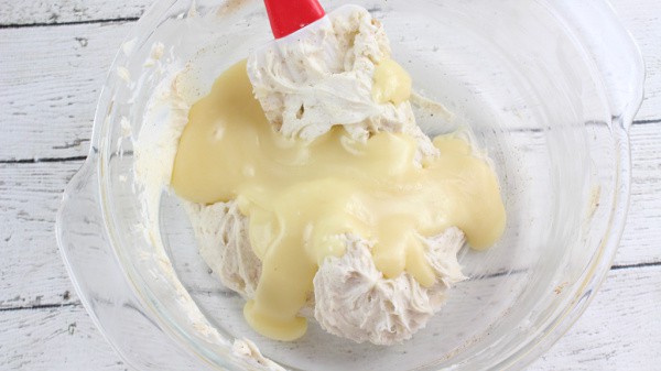 Fold the melted white chocolate into the eggnog truffles mixture