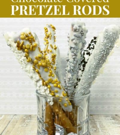 New Years White Chocolate dipped pretzel rods with silver and gold sprinkles
