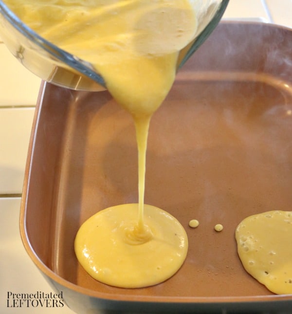 adding grain-free pancake batter to the skillet