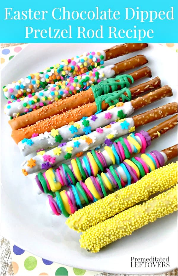 Easter white chocolate covered pretzel rods decorated with sprinkles on a platter