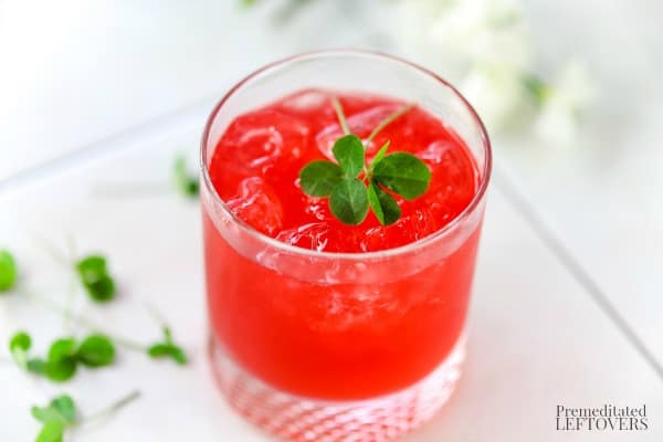 Irish Jack Cherry Rose Cocktail with clovers