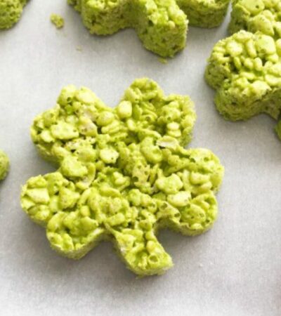 green shamrock rice krispie treats on waxed paper