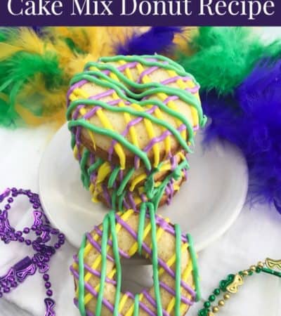Mardi Gras cake mix donuts on plate with beads