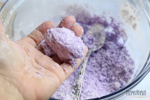 Adding water to ingredients for Mermaid Bath Bomb Recipe
