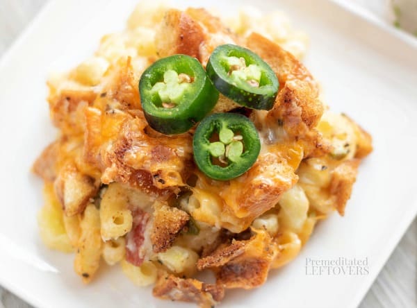 Creamy Jalapeño Popper Macaroni and Cheese Recipe plated and topped with sliced jalapeno peppers.