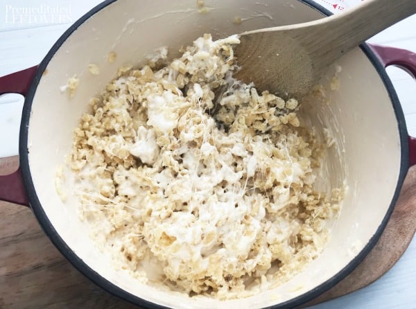 Fold the rice krispies into the melted marshmallows and butter.