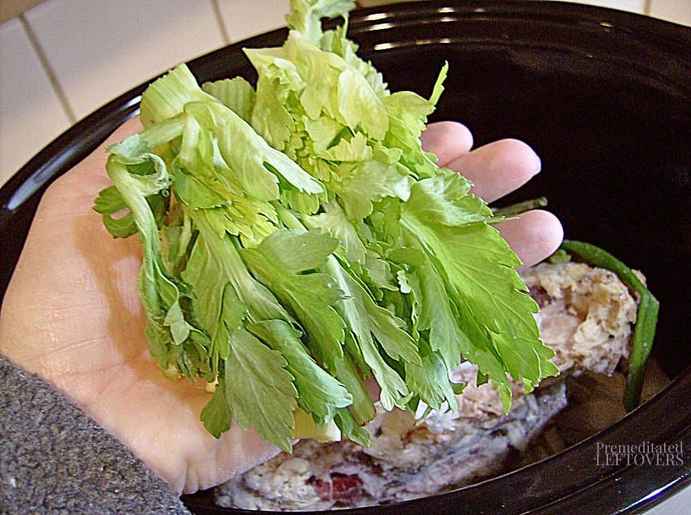 Add celery tops to slow cooker