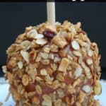 This delicious granola coated caramel apple recipe is easy to make! Simply dunk apples into melted caramel then roll them in granola.