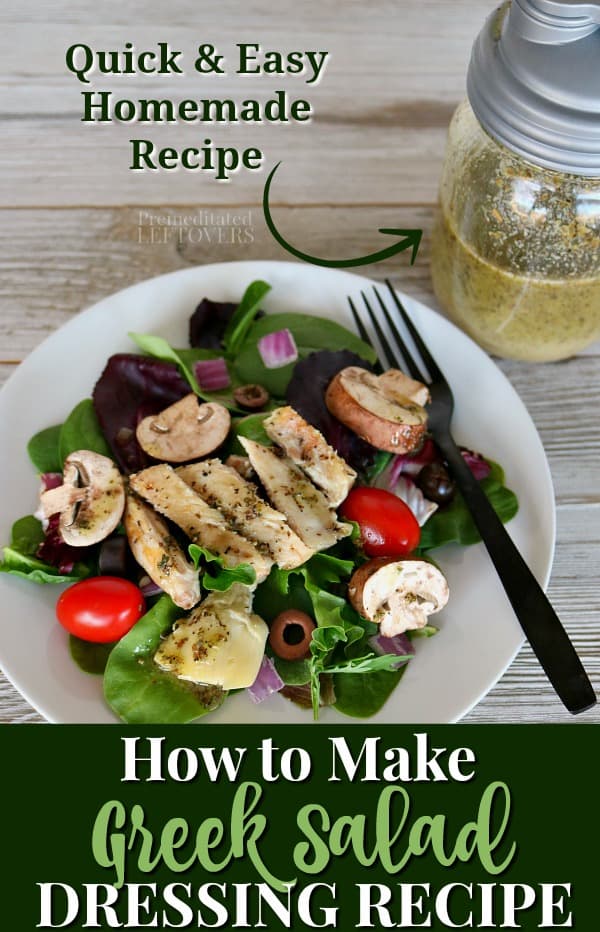 Homemade Greek salad dressing recipe on top of a garden salad with chicken.